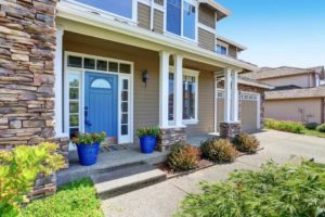 beige siding with blue door