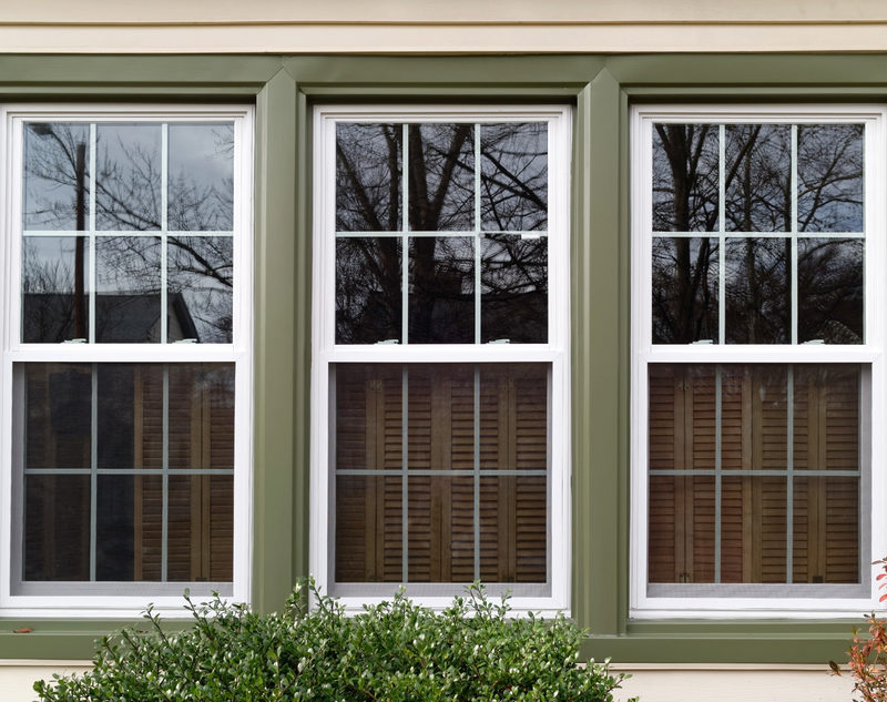 3 glass pane windows on the side of house