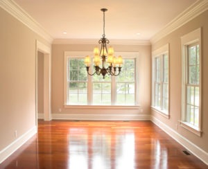 Unfurnished room with walls of beautiful windows and a chandelier overhead