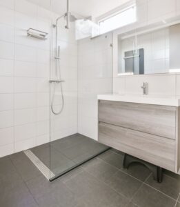 Explore small bathroom ideas that make compact spaces feel larger with walk-in showers, smart storage, better lighting, and modern design tips.
